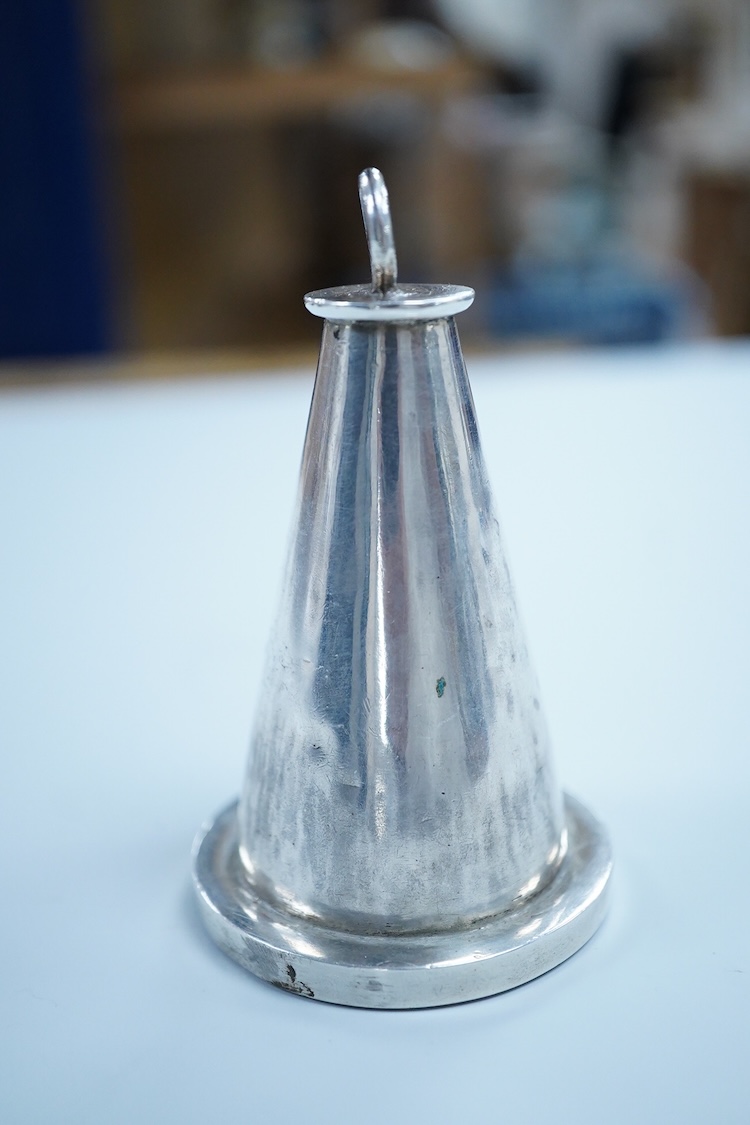 An Islamic white metal seal, of conical form with small ring handle, overall 83mm, 135 grams.